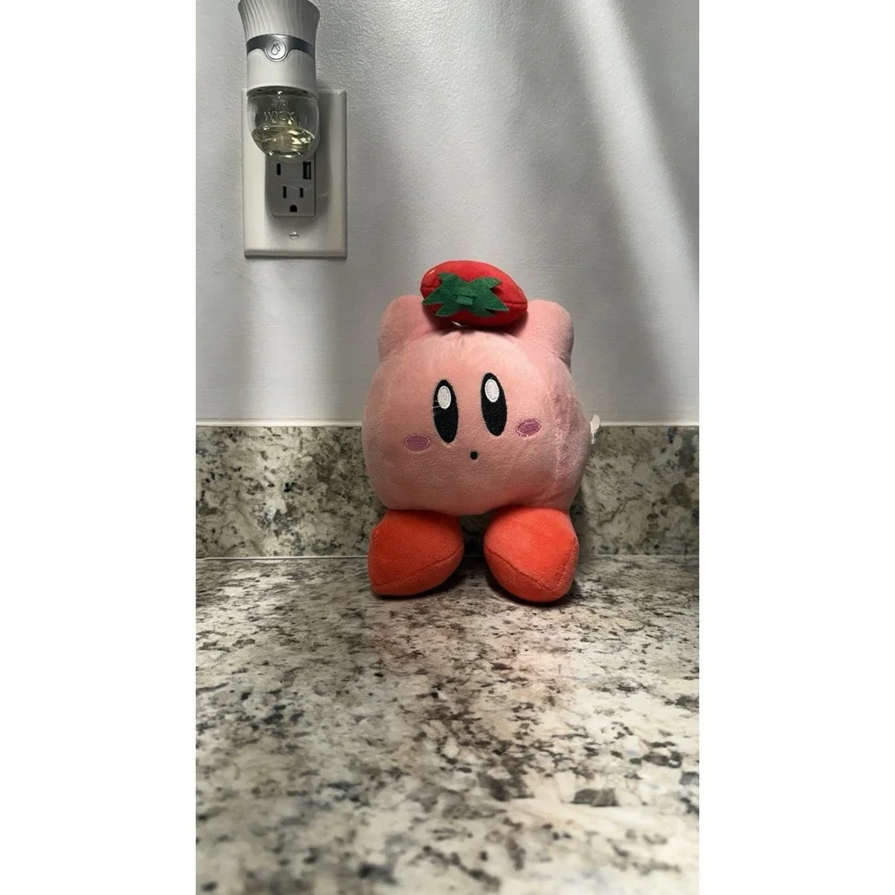 Kirby with strawberry plush